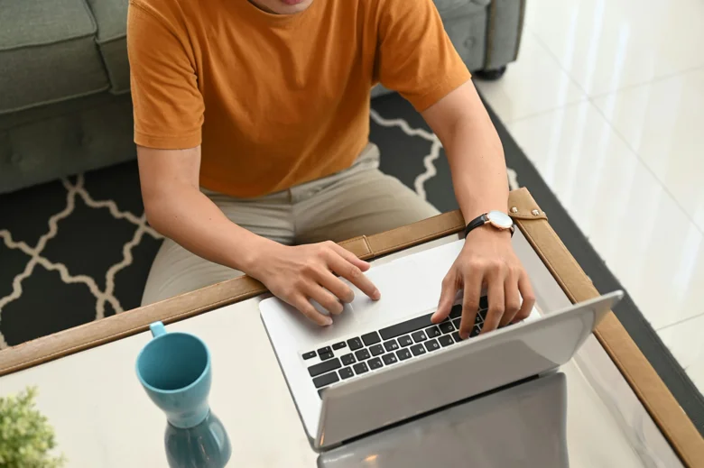 Person using a laptop at a table